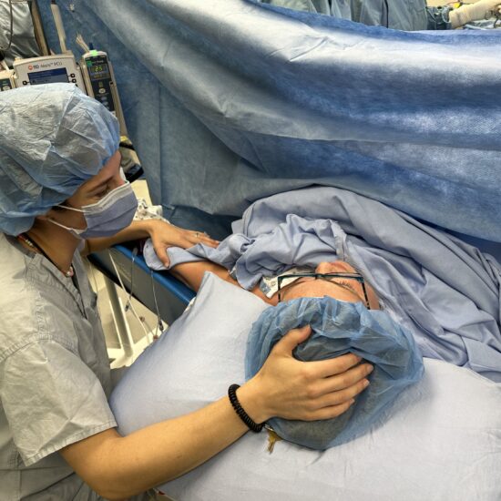 Allison supporting Ashley during her emergency c-section